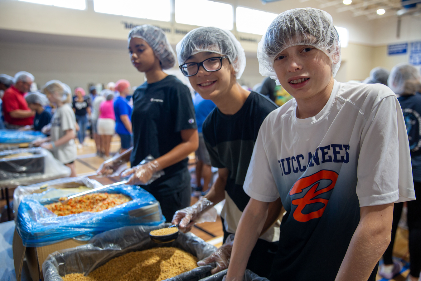 Volunteers distributing food to families in need